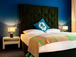 Łóżko lub łóżka w pokoju w obiekcie Hotel Villa Carlton - Adults Only