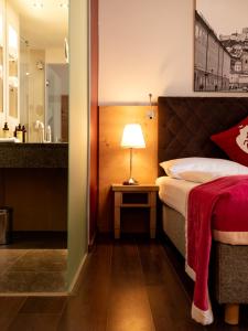 Łóżko lub łóżka w pokoju w obiekcie Hotel Villa Carlton - Adults Only