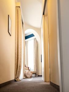 Łóżko lub łóżka w pokoju w obiekcie Hotel Villa Carlton - Adults Only