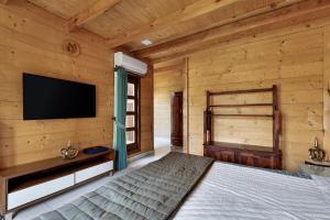 מיטה או מיטות בחדר ב-The Pine Loft