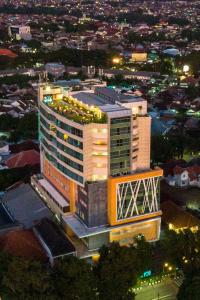 a large building with lights on top of it at night at THE 1O1 Malang OJ in Malang