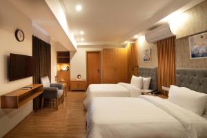 Ένα ή περισσότερα κρεβάτια σε δωμάτιο στο Hotel One Tower Gulberg, Lahore