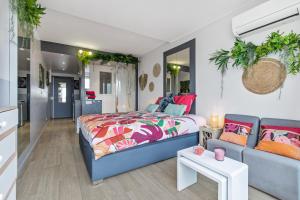 a bedroom with a bed and a couch at Sweet dream Port nature in Cap d'Agde