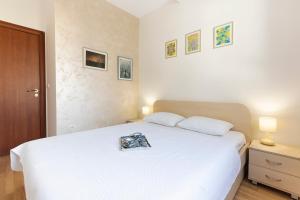 Ένα ή περισσότερα κρεβάτια σε δωμάτιο στο Beautiful Tiki Apartment