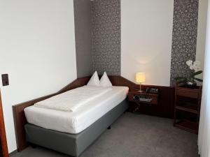 Ένα ή περισσότερα κρεβάτια σε δωμάτιο στο Hotel Garni Geisler +33 φωτογραφίες