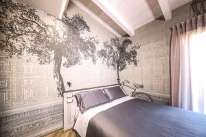 Кровать или кровати в номере Vicolo Malavolta 7 Rooms and Suites
