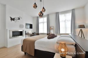 Voodi või voodid majutusasutuse Hôtel l'Ecrin d'Ô toas