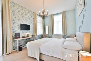 Voodi või voodid majutusasutuse Hôtel l'Ecrin d'Ô toas