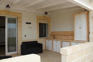 A kitchen or kitchenette at Ricciolandia Suites