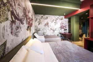 Posteľ alebo postele v izbe v ubytovaní Vicolo Malavolta 7 Rooms and Suites