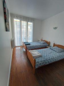 Postel nebo postele na pokoji v ubytování Echappée Belle à Montauban - garage