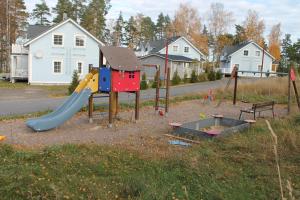 a playground with a slide and a slideintend at SResort Apartment with 4 bedrooms in Imatra