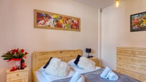 Posteľ alebo postele v izbe v ubytovaní Apartament Sywarne Deluxe