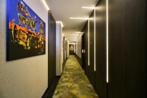 a corridor of a hallway with a long aisle at Bourbon Boutique Hotel in Yerevan