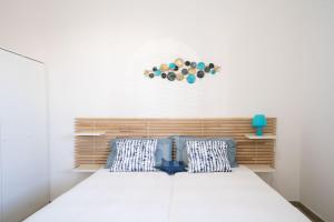 Ένα ή περισσότερα κρεβάτια σε δωμάτιο στο Villa Kambusa
