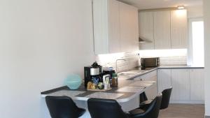 Kuchyňa alebo kuchynka v ubytovaní Amarina Apartman