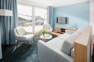 TV a/nebo společenská místnost v ubytování Apartmenthaus B3
