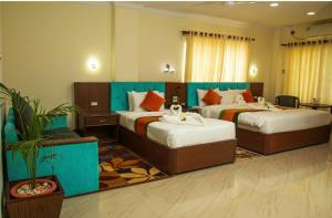 Gautam Buddha Airport Hotel客房内的一张或多张床位