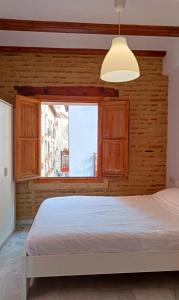 Lova arba lovos apgyvendinimo įstaigoje Apartamentos con encanto en pleno casco antiguo RON VALENCIAYOLE