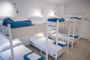 Postel nebo postele na pokoji v ubytování PALACIO REAL HOSTEL