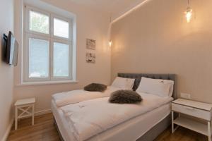 Posteľ alebo postele v izbe v ubytovaní Imperial Apartments Helska