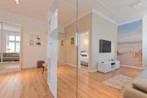 Televízia a/alebo spoločenská miestnosť v ubytovaní Imperial Apartments Helska