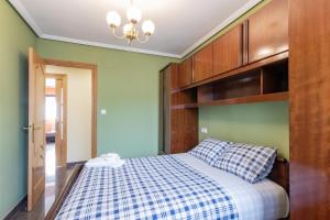 Postelja oz. postelje v sobi nastanitve Confortable piso en Lekeitio, a 7 minutos de la playa