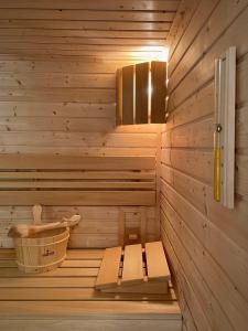a room with a sauna with a bench in it at Apartmány Bašta & Wellness in Sušice