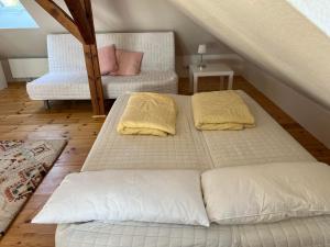 two beds sitting on the floor in a room at Westfälischer Hof - Loft 