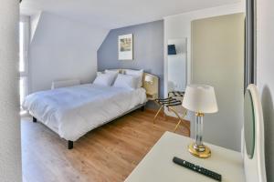 Postel nebo postele na pokoji v ubytování Grand Hôtel d'Espagne