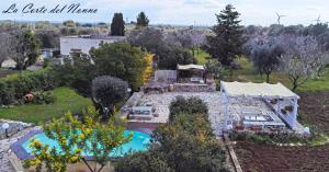 an aerial view of a house with a swimming pool at La corte del nonno by Itriahomes in Ceglie Messapica