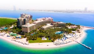 an aerial view of a resort on a beach at Rixos The Palm Luxury Suite Collection - Ultra All Inclusive in Dubai
