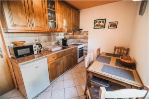 A kitchen or kitchenette at Apartma Rombon Brdo with Free Onsite Parking