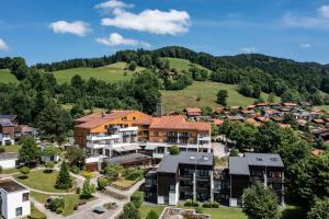 an aerial view of a residential estate in the mountains at Karma Bavaria in Schliersee