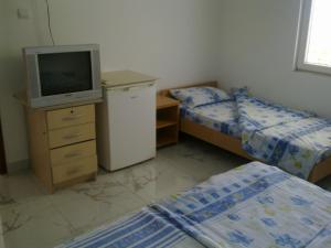 Postel nebo postele na pokoji v ubytování Guest House Sandra