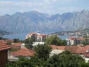 a city with a mountain range and mountains at Guest House Sandra in Kotor