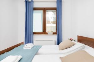 Postel nebo postele na pokoji v ubytování Villa 4 Pory Roku by Noclegi Renters