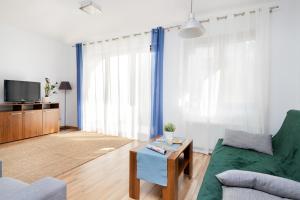 TV a/nebo společenská místnost v ubytování Villa 4 Pory Roku by Noclegi Renters