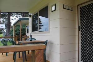 a patio area with a table and chairs at Millicent Hillview Caravan Park in Millicent