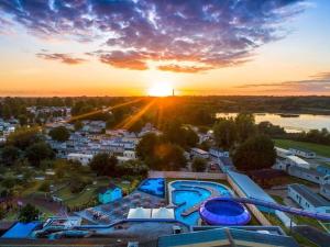 an aerial view of a resort with the sunset at Caravan Kensington 46 at Marton Mere Blackpool in Blackpool