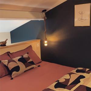 a bedroom with a bed with a cow patterned pillow at La Casita in Pouilly-le-Monial +18 photos