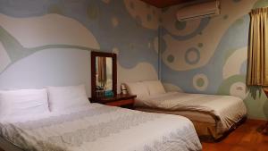 Postel nebo postele na pokoji v ubytování Erfen De Homestay