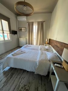 Giường trong phòng chung tại Galaxidi Sea View Apartment , Galaxidi