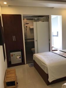Rúm í herbergi á Danang Classic Hotel