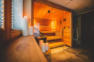 Ένα ή περισσότερα κρεβάτια σε δωμάτιο στο Boutique Hotel und Chalets Bergwiesenglück