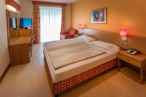 Posteľ alebo postele v izbe v ubytovaní Hotel Ideal