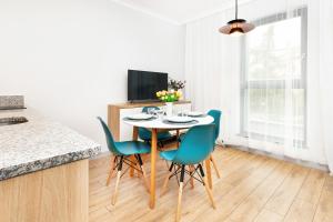Televízia a/alebo spoločenská miestnosť v ubytovaní Browar Gdański Free Parking by Noclegi Renters