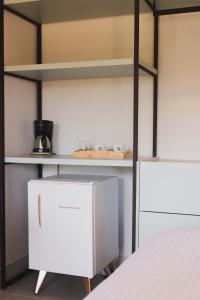 a bedroom with a bunk bed and a white cabinet at Øko Villa in Juquei
