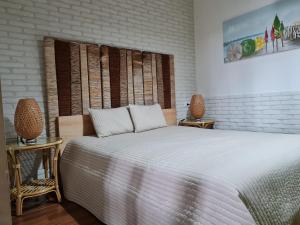 Postel nebo postele na pokoji v ubytování L'ISOLA AeR B&B