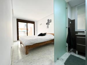 A bed or beds in a room at Bear Holiday - Apartment Maria in Moraira near the Beach